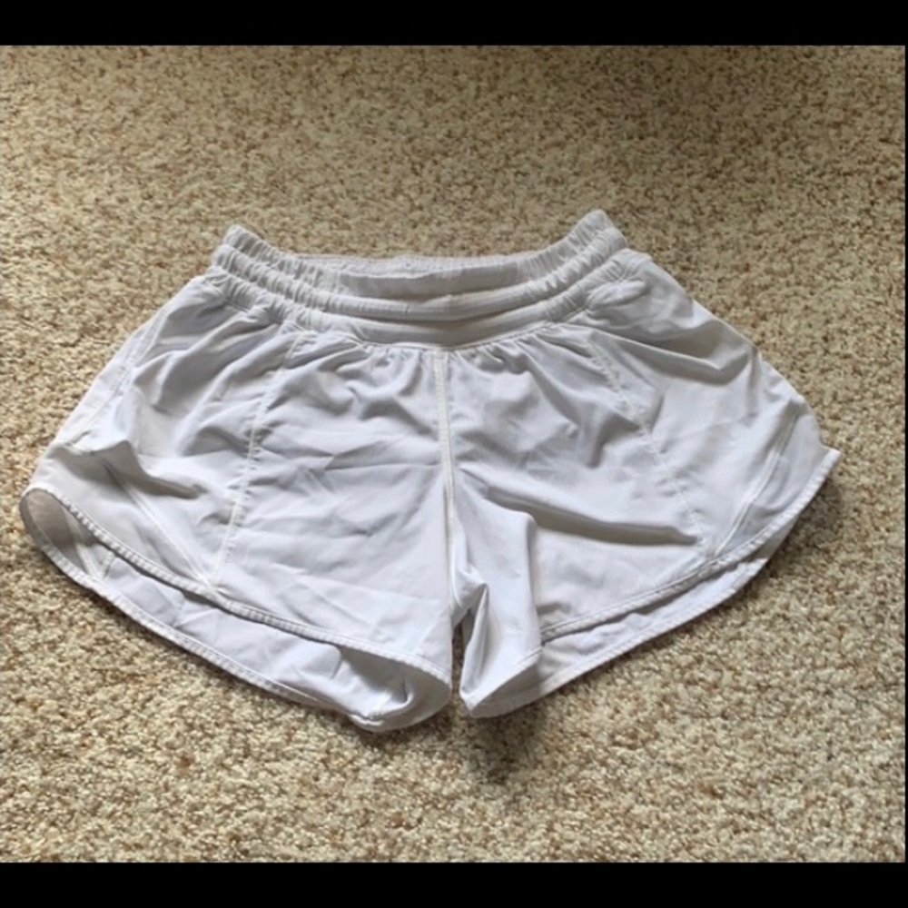 WHITE LULULEMON SHORTS (size 2 4 inch inseam)